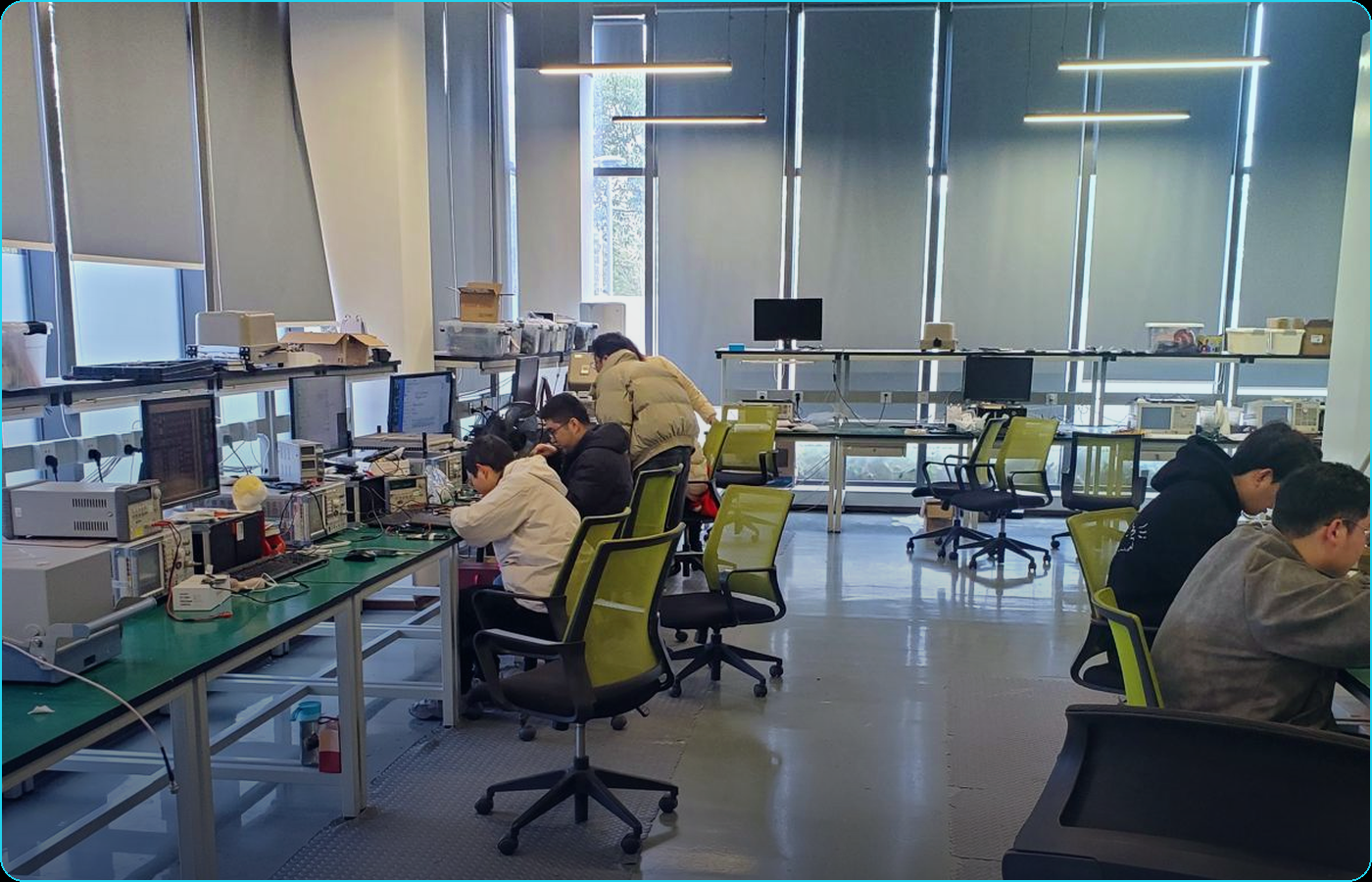 Newstart R&D lab in Singapore — engineers working on FPGA platforms
